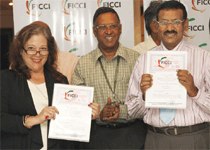 The Director, HEMRL, DRDO, Dr. Subhananda Rao and the President, Crowe & Company, LLC, USA, Ms. Faye Crowe showing the signed documents of the Memorandum of Understanding (MoU) on technology for explosive detection kit